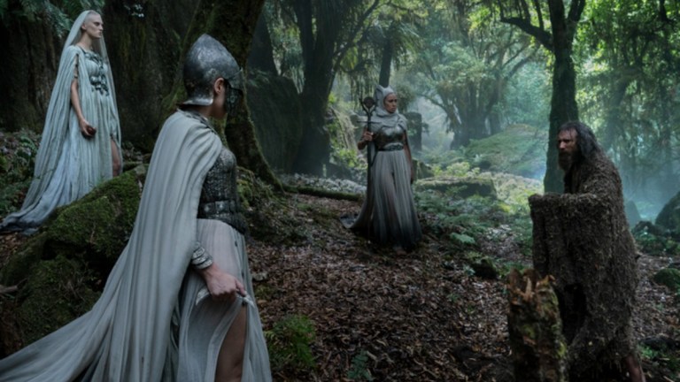 The Nomad (Edith Poor), The Dweller (Bridie Sisson), and The Ascetic (Kali Kopae) surround The Stranger (Daniel Weyman) in the woods