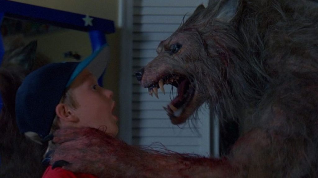 The werewolf strangles a kid in Bad Moon