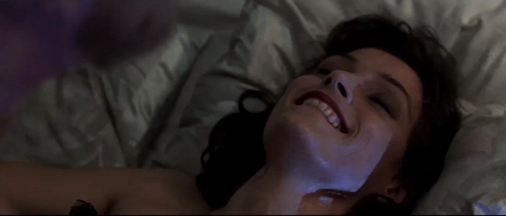 Xenia Onatopp in bed scene in Goldeneye