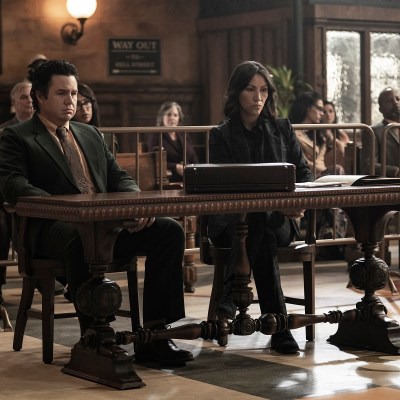 Josh McDermitt as Eugene and Eleanor Matsuura as Yumiko sit in a courtroom on The Walking Dead season 11 episode 22.