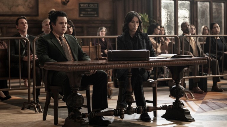 Josh McDermitt as Eugene and Eleanor Matsuura as Yumiko sit in a courtroom on The Walking Dead season 11 episode 22.