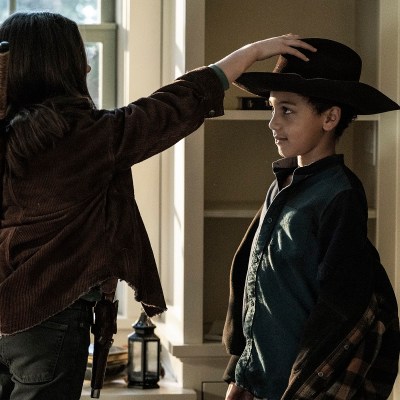 Cailey Fleming as Judith gives Anthony Azor as RJ Rick's hat on The Walking Dead season 11 episode 23.
