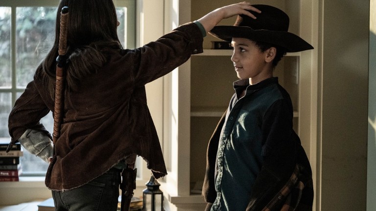 Cailey Fleming as Judith gives Anthony Azor as RJ Rick's hat on The Walking Dead season 11 episode 23.