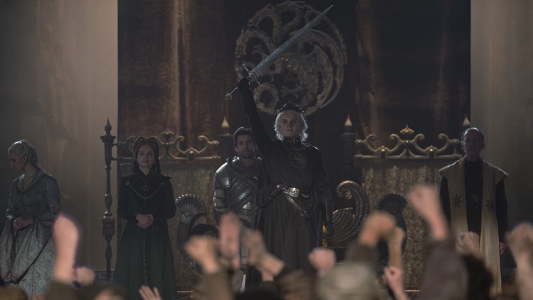 Aegon II (Tom Gynn-Carney), Alicent (Olivia Cooke) and Ser Crismón (Fabian Frankel) at Aegon II's coronation in House of the Dragon