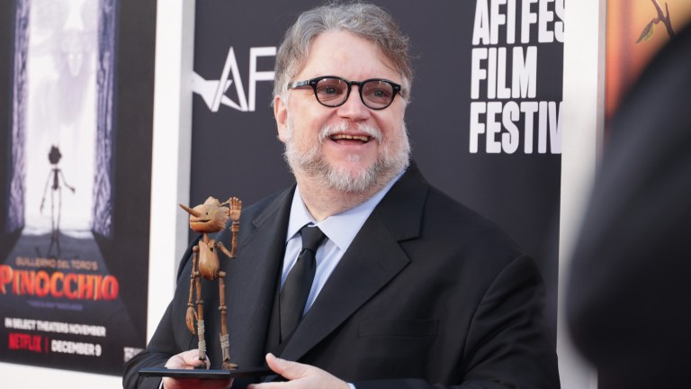 Guillermo del Toro holding Pinocchio