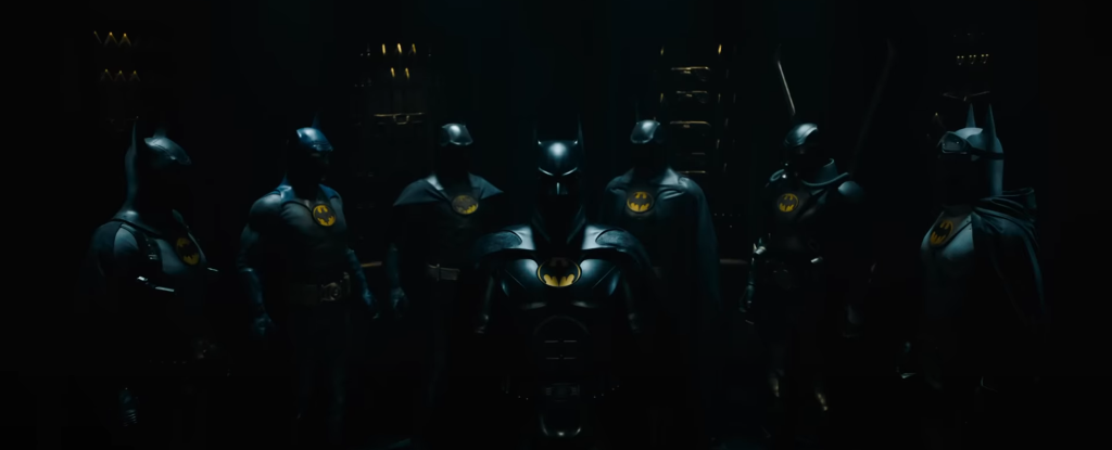 the assorted Batman costumes in The Flash movie trailer