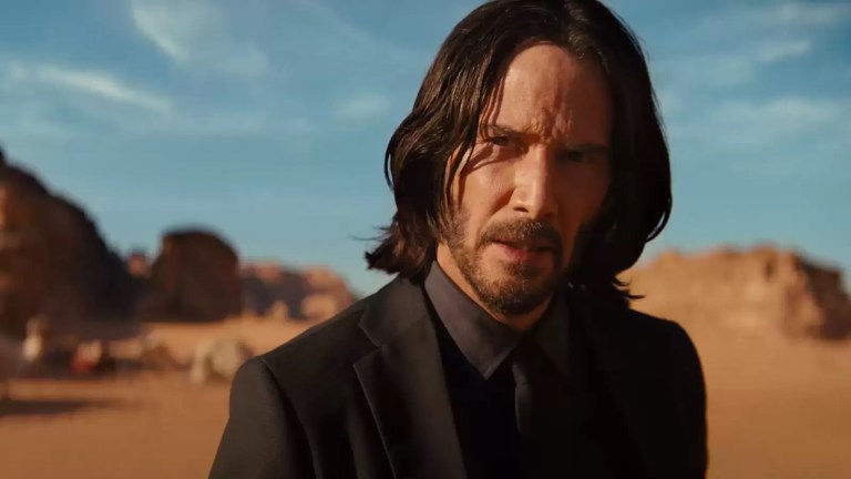 Keanu Reeves in desert in John Wick Chapter 4