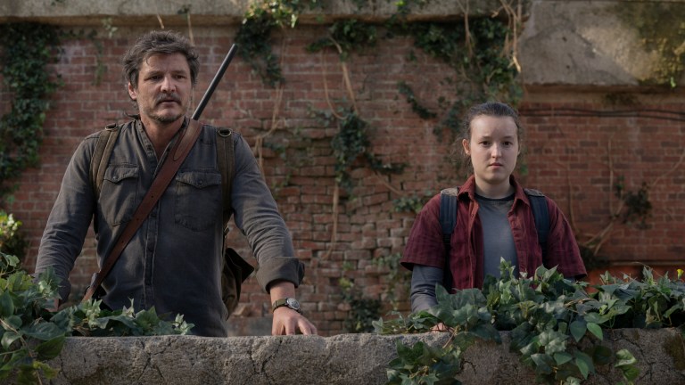 Joel (Pedro Pascal) and Ellie (Bella Ramsey) look out into the distance in The Last of Us