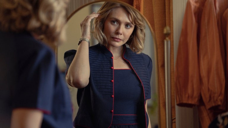 Elizabeth Olsen as Candy Montgomery looks at herself in the mirror