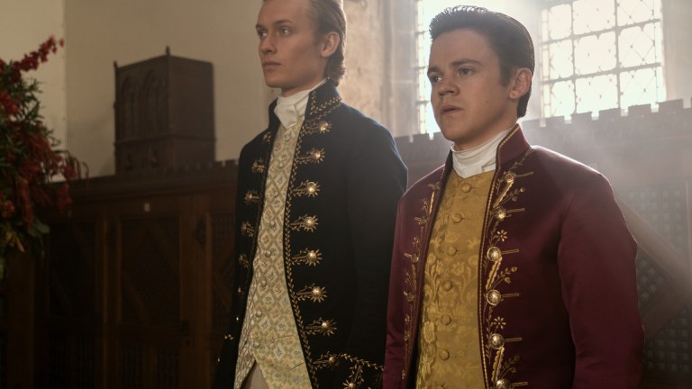 Freddie Dennis as Reynolds, Sam Clemmett as Young Brimsley in episode 101 of Queen Charlotte: A Bridgerton Story.