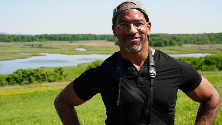 Christian Cooper surveys the new grasslands at Freshkills Park.