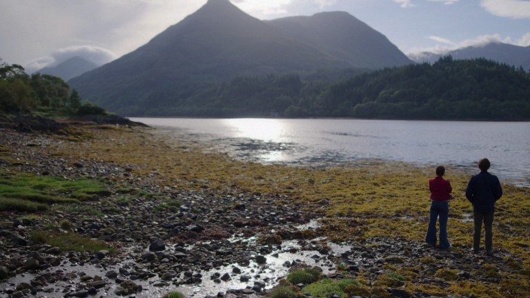 Pia (Myha'la Herrold) and Davis (Samuel Blenkin) stand looking out over Loch Henry