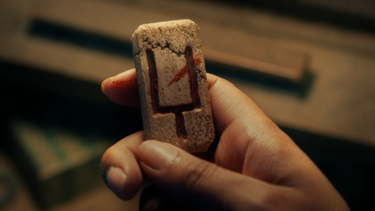 A demonic talisman in Black Mirror season 6 "Demon 79."