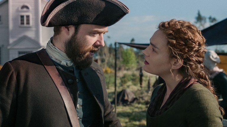 Richard Rankin as Roger Mackenzie and Sophie Skelton as Brianna Mackenzie in Outlander Season 7