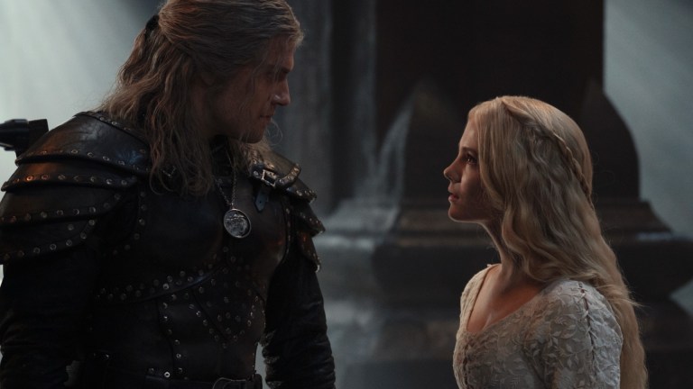 Geralt (Henry Cavill) and Ciri (Freya Allan) stare at each other in Kaer Morhen