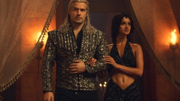Geralt (Henry Cavill) and Yennefer (Anya Chalotra) enter the Conclave ball at Aretuza