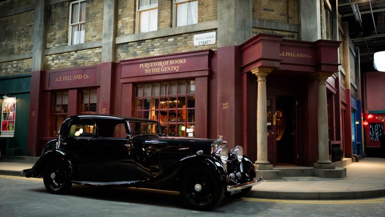 Good Omens 2 Crowley car outside bookshop