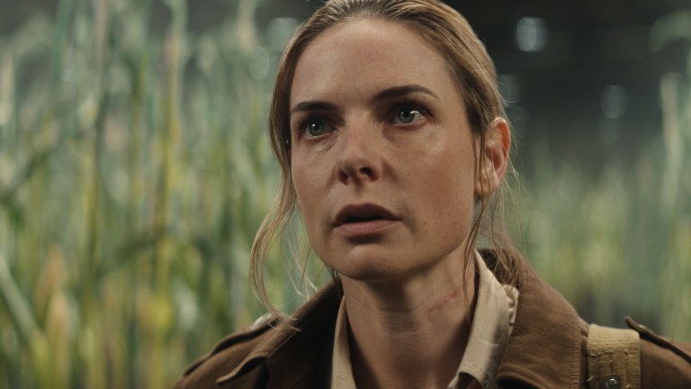 Juliette (Rebecca Ferguson) stands in a field of corn