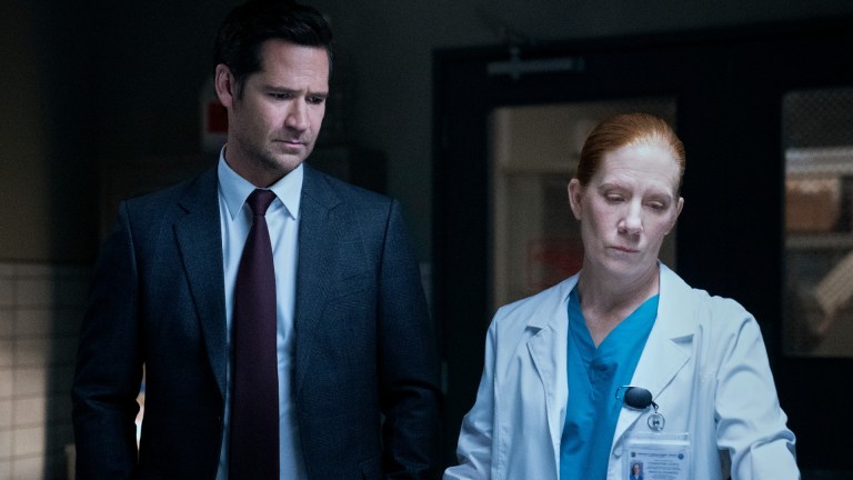 The Lincoln Lawyer. (L to R) Manuel Garcia-Rulfo as Mickey Haller, Nancy Lantis as Medical Examiner in episode 210 of The Lincoln Lawyer.