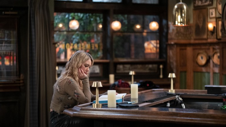 Sophie (Hilary Duff) sits alone in Pemberton's bar in How I Met Your Father