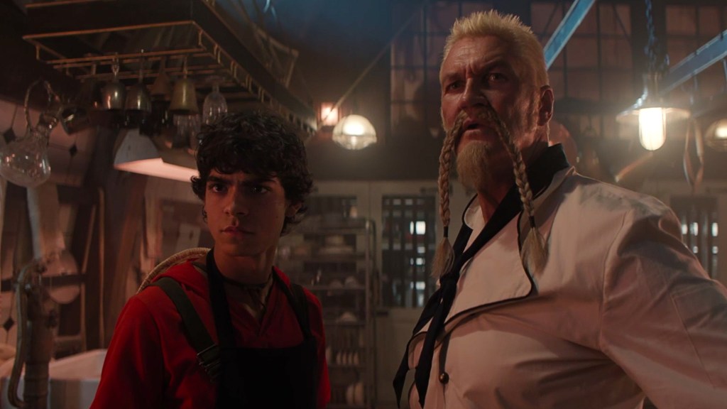 One Piece. (L to R) Iñaki Godoy as Monkey D. Luffy, Craig Fairbass as Zeff in season 1 of One Piece. Cr. Courtesy of Netflix © 2023