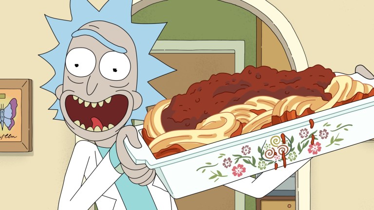Rick holds up a dish of his famous spaghetti