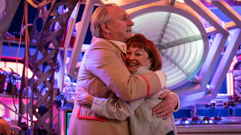 Peter Davison and Janet Fielding hug in Tales of the TARDIS: Earthshock