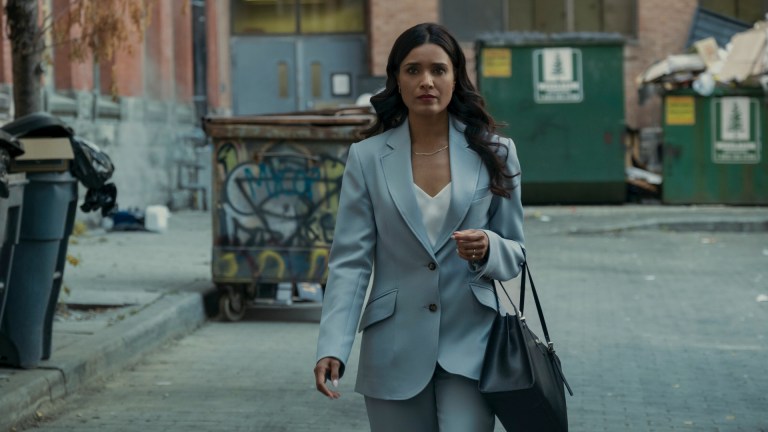 Dean Shetty (Shelley Conn) walks through an alley to meet Colonel Mallory on Gen V