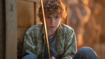Percy Jackson (Walker Scobell) lies in wait, holding his sword Riptide