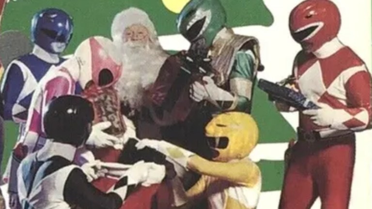 The cover of the Power Rangers VHS tape, "Alpha's Magical Christmas" with the morphed Rangers around Santa.