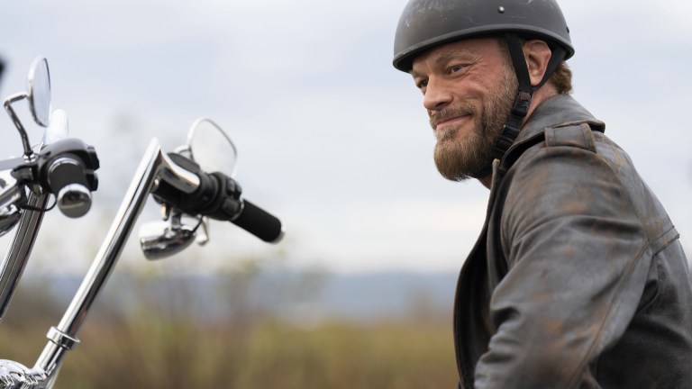 Ares (Adam Copeland) rides a motorcycle in Percy Jackson and the Olympians