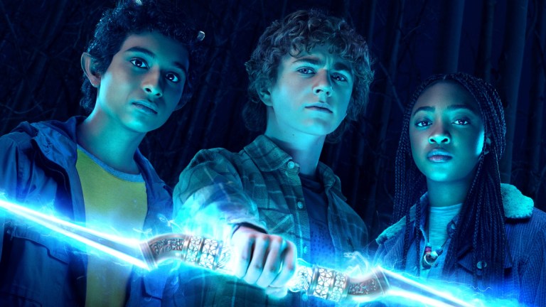 Grover Underwood (Aryan Simhadri), Percy Jackson (Walker Scobell), and Annabeth Chase (Leah Sava Jeffries) stand in the presence of Zeus' master lightning bolt