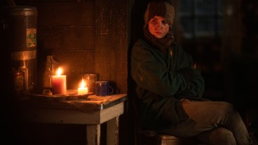 Teen Shauna (Sophie Nélisse) stands in the cabin in Yellowjackets season 2