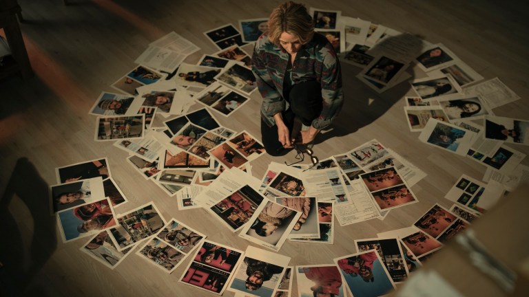 Jodie Foster looking at a circle of photos in True Detective: Night Country