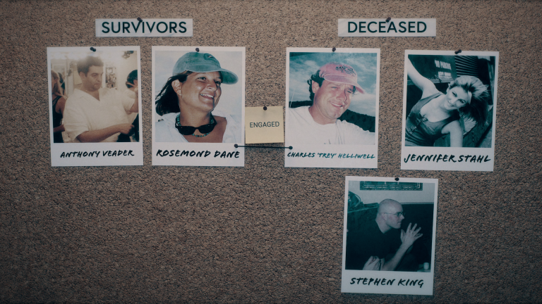 A cork board featuring Polaroid photos of "Survivors" and "Deceased" from the Carnegie Deli Murders.