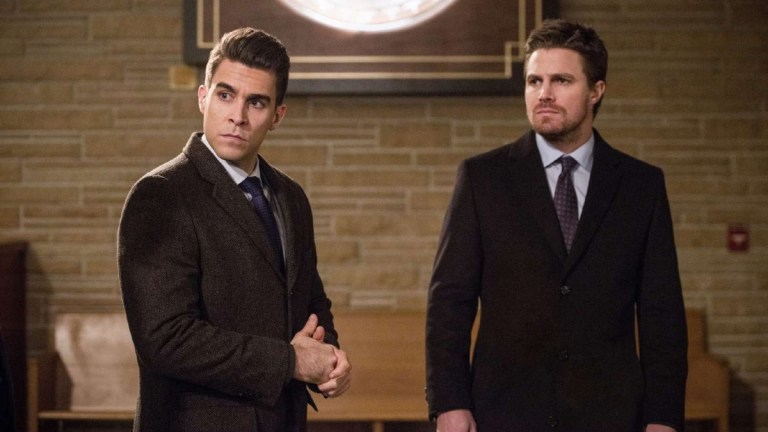 Josh Segarra as Adrian Chase and Stephen Amell as Oliver Queen in Arrow