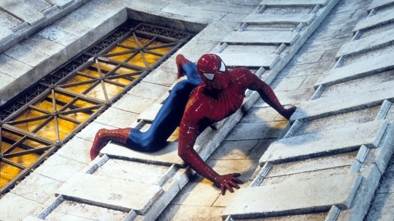 Spiderman climbing a tall building in a scene from the film 'Spiderman', 2002.