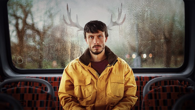 Richard Gadd in a yellow jacket with antlers in the poster for Netflix drama Baby Reindeer