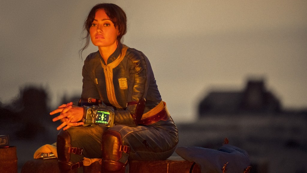 Lucy (Ella Purnell) looks exhausted in a post-apocalyptic wasteland in Amazon Prime Video&rsquo;s Fallout