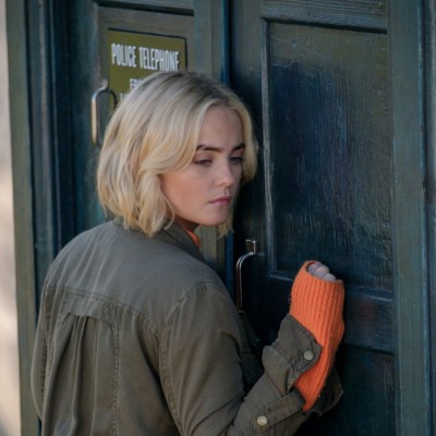 Millie Gibson as Ruby Sunday standing outside a locked TARDIS in Doctor Who episode "73 Yards"