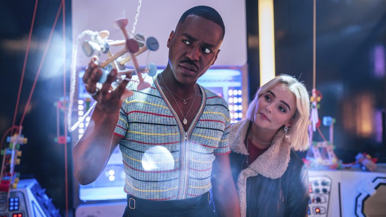 Ncuti Gatwa and Millie Gibson holding a toy in Doctor Who episode "Space Babies"