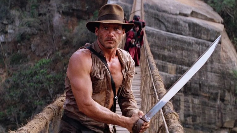 Harrison Ford in Indiana Jones and the Temple of doom with sword and bridge