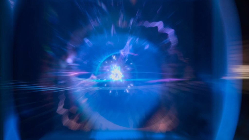 A blue and purple sci-fi shape surrounding the TARDIS roof light in the opening credits of new Doctor Who.