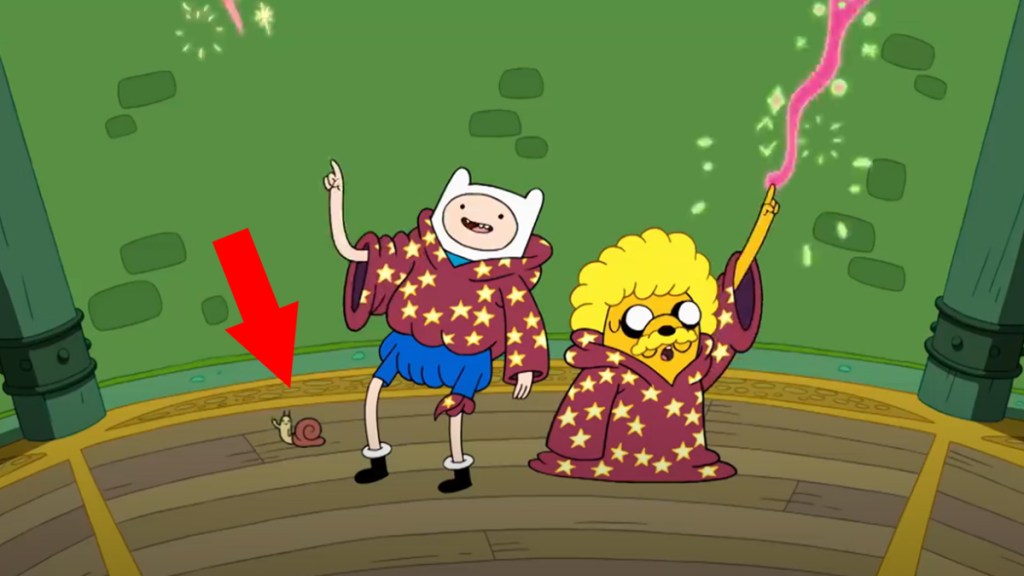 Finn and Jake wearing wizard robes in cartoon Adventure Time with an arrow pointing at a waving snail.