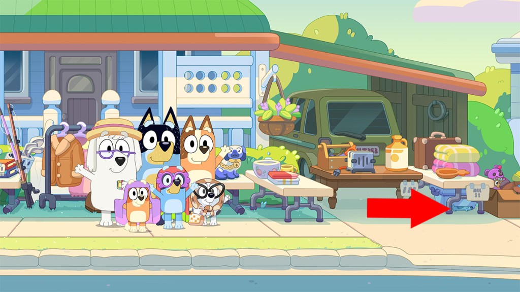 Screengrab of Bluey with an arrow pointing at the hidden Long Dog under the table.