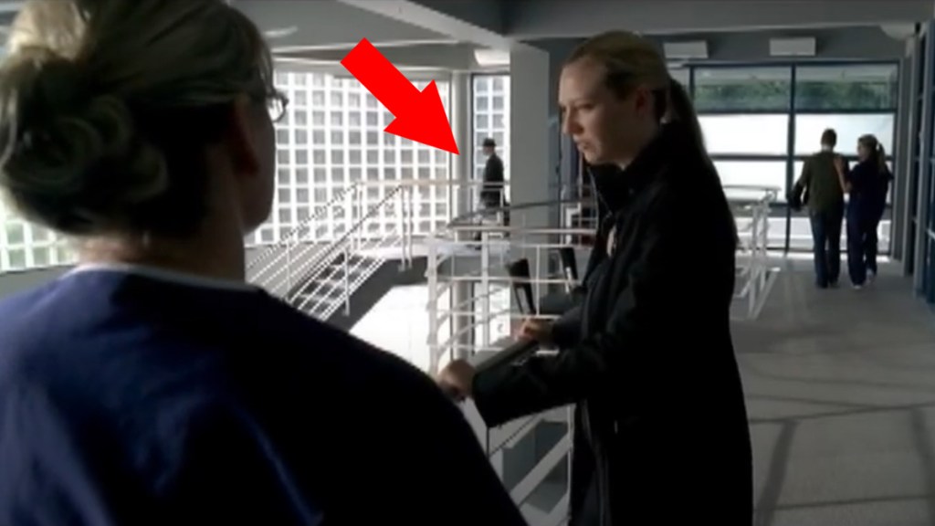 Screengrab of Fringe with an arrow pointing at the Observer in the back of shot