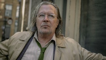 Gary Oldman wearing a dirty coat and tie in Slow Horses season 3