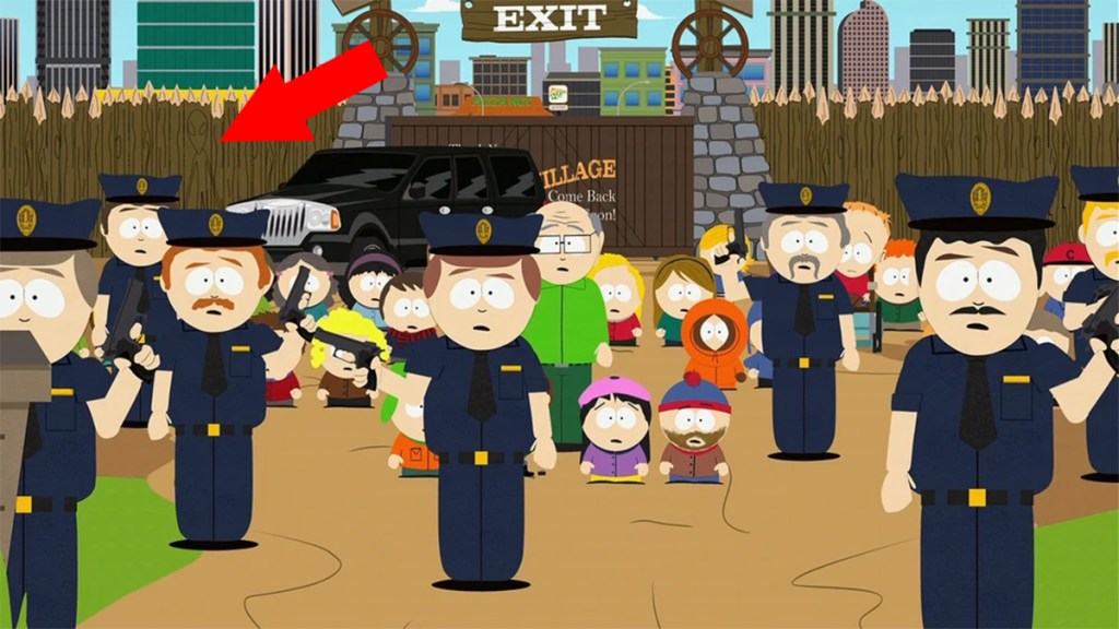 Screengrab of South Park with an arrow pointing at a hidden alien in the fence
