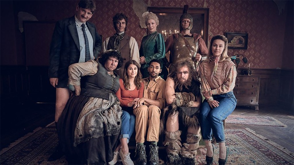 The German cast of Ghosts sitting in a group in an old house