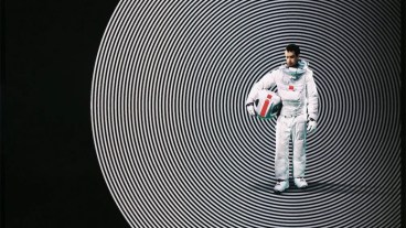 Cropped detail of Sam Rockwell in a spacesuit for the poster for 2009 movie Moon